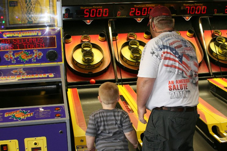 Jacob plays Skee Ball with Daddy
